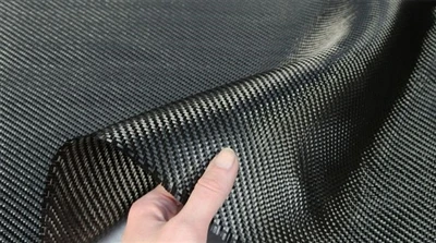 How can carbon fiber composites overcome toughness limitations?